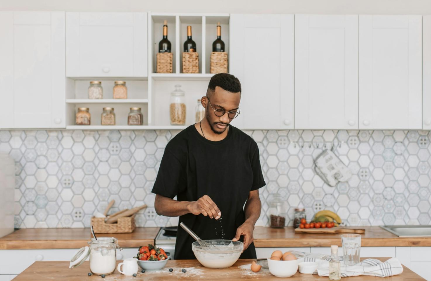 Kitchen workspace setup with meal prep containers and fresh ingredients